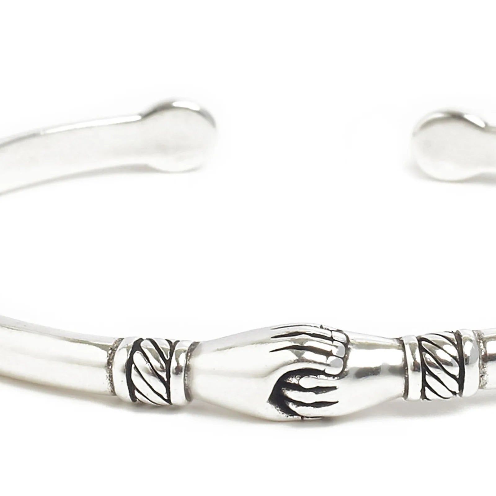 Detailed view of Stainless Steel Bracelets cuff with polished metal, handshake motif, and etching