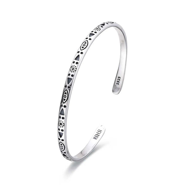 Sterling Silver Mens Bracelet shown in angled profile with geometric symbols and open cuff ends