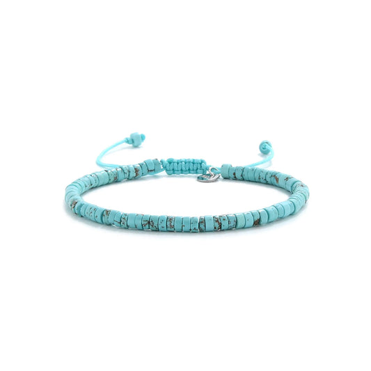turquoise beads shown in full view with turquoise clay beads with silver charm and adjustable cord