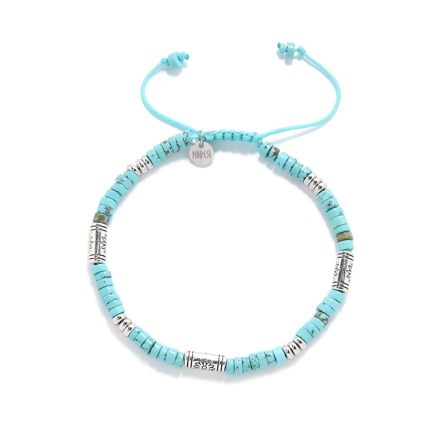 Turquoise Jewelry for Sale shown from above with turquoise clay beads with engraved silver spacers and round bracelet shape