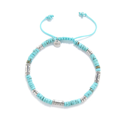 Turquoise Jewelry for Sale shown from above with turquoise clay beads with engraved silver spacers and round bracelet shape
