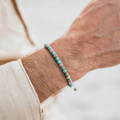 Turquoise Jewelry worn on a wrist with a light sleeve