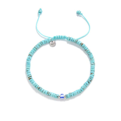 turquoise men's bracelets shown from above with turquoise clay beads with blue accent bead and round bracelet shape
