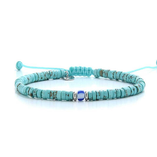 Full side view of turquoise men's bracelet featuring adjustable knot and ceramic beads