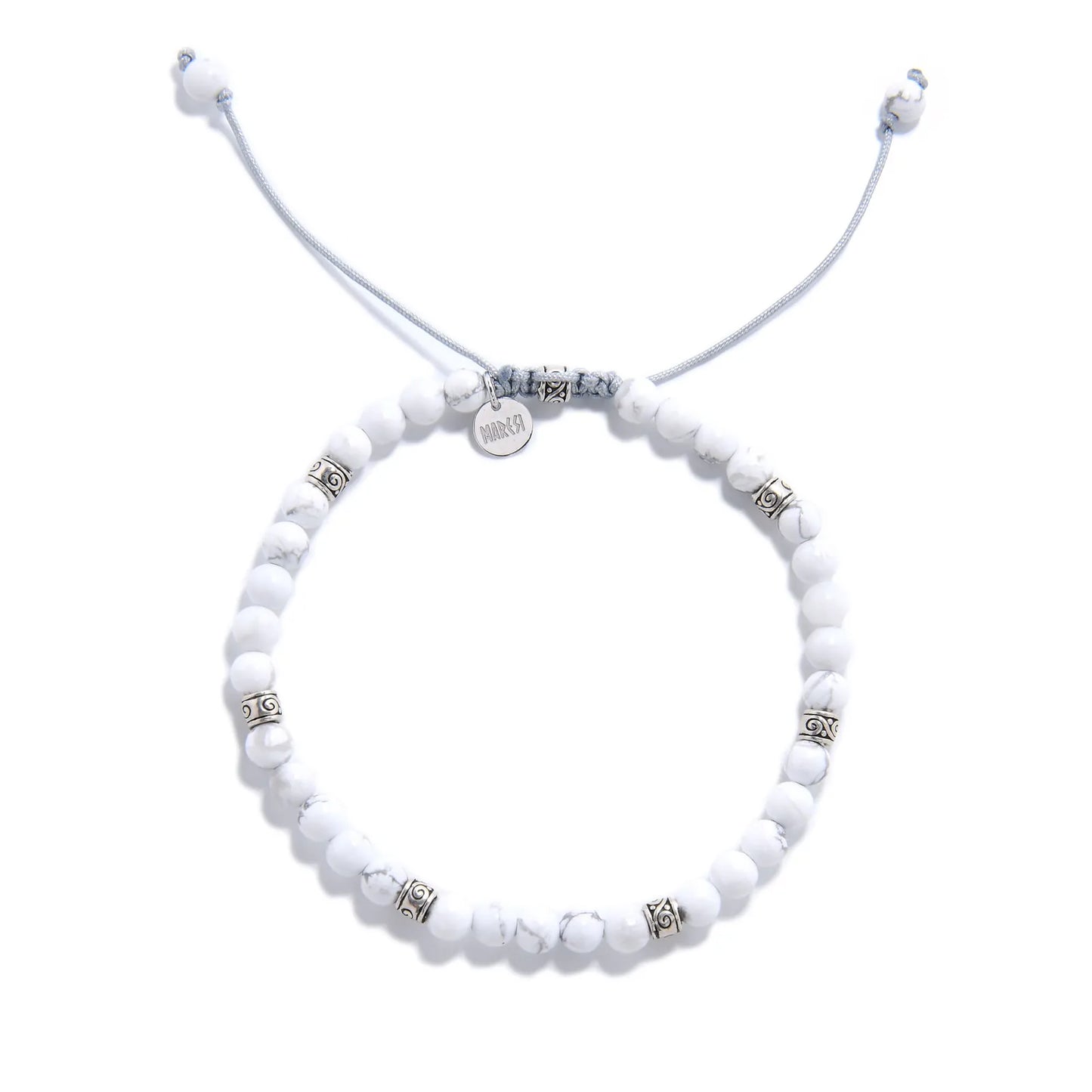 White Howlite Bracelet top view with round beads, charm, and adjustable cord
