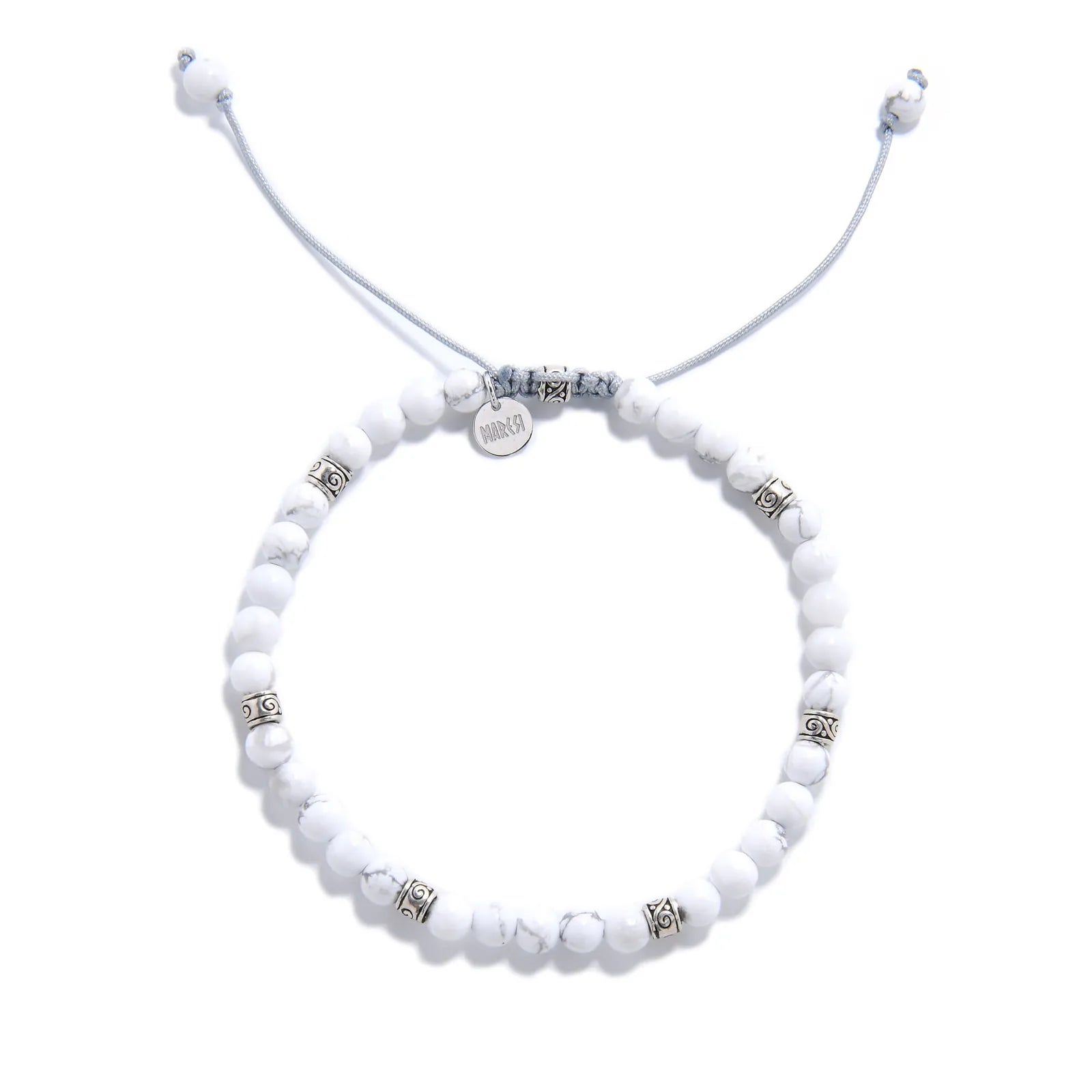 White Howlite Bracelet top view with round beads, charm, and adjustable cord