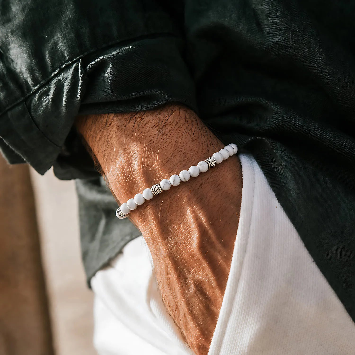 White Howlite Bracelet worn on a wrist with beaded design and adjustable cord