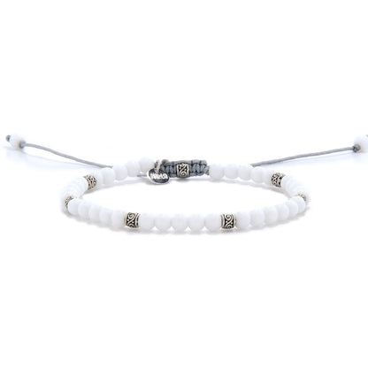 White Jade Bracelet full view with white round beads, silver spacers, and light gray adjustable cord.