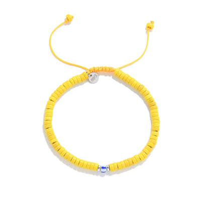 Yellow Beads shown from above with yellow clay beads with blue accent bead and round bracelet shape