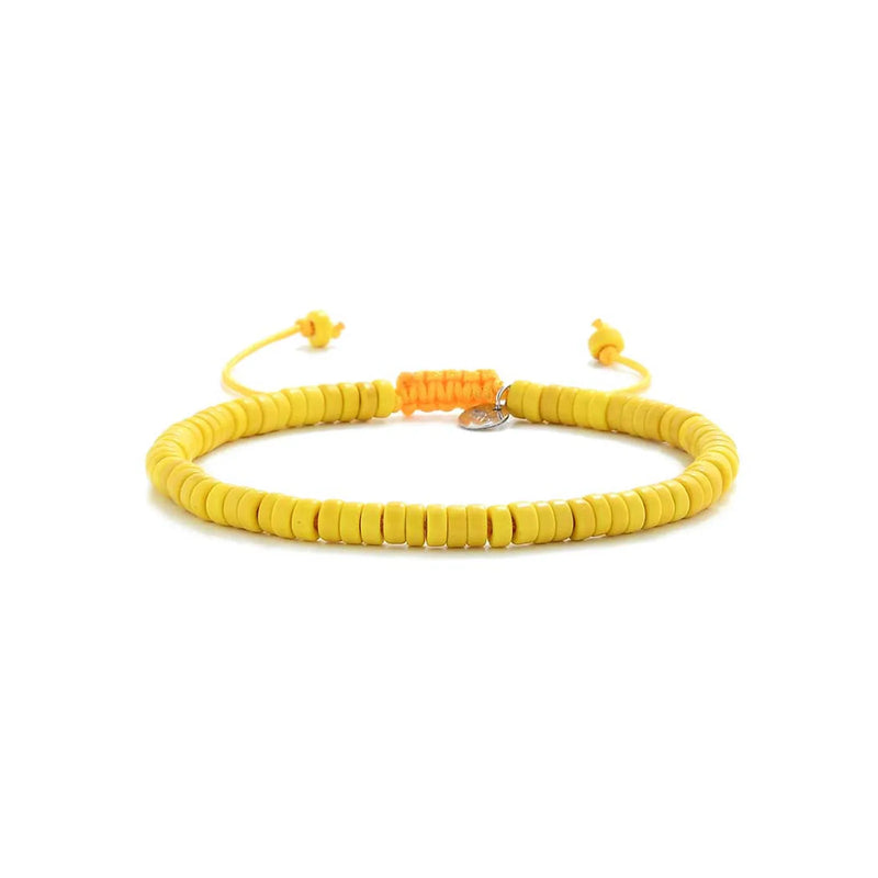 Yellow Bracelet shown in full view with yellow clay beads with silver charm and adjustable cord