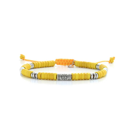 Yellow Gemstone Jewelry shown in full view with yellow clay beads with engraved silver spacers and adjustable cord
