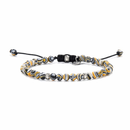Malachite beads in yellow, black, and white tones with detailed metal spacers